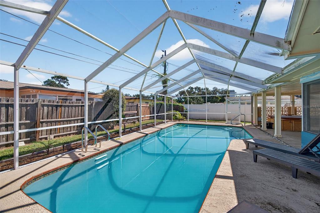 1576 Rosery Road Northeast Largo, FL 33756 - Photo 9 of 54 a view of a tennis room with wooden floor