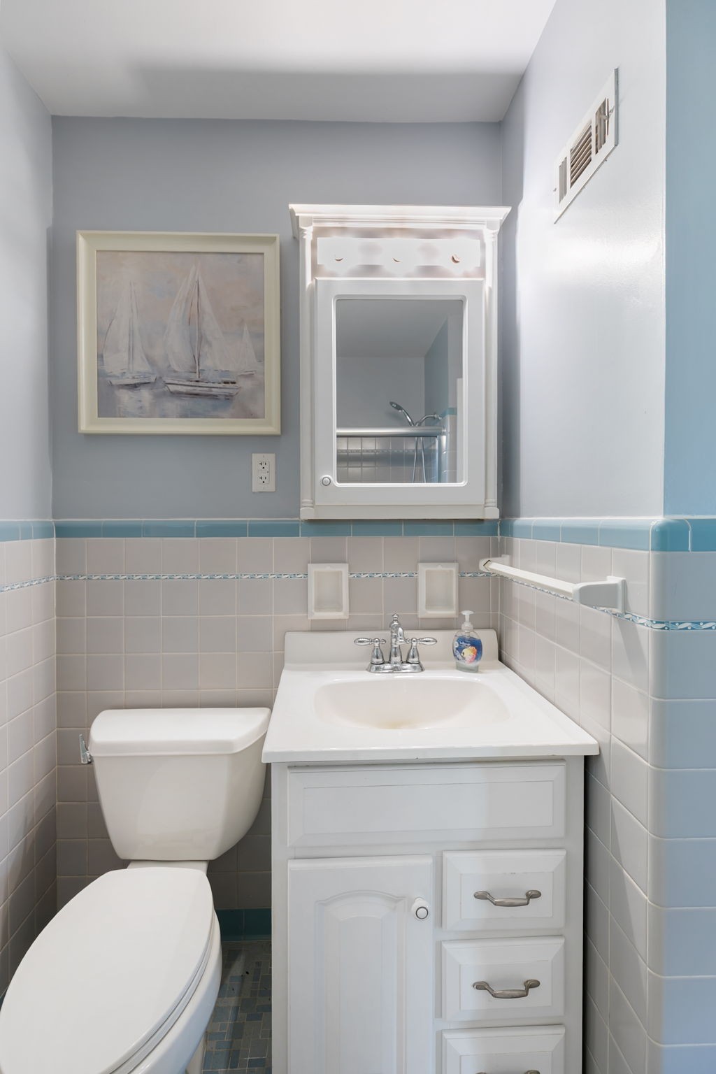 307 Shepherd Hills Drive Madison, TN 37115 - Photo 23 of 30 a bathroom with a toilet a sink and mirror