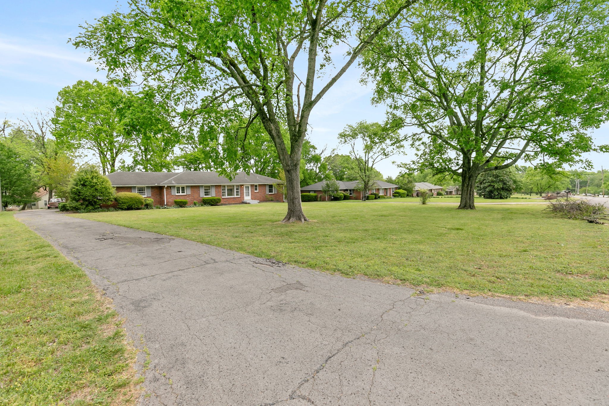 307 Shepherd Hills Drive Madison, TN 37115 - Photo 4 of 30 a view of a park with large trees