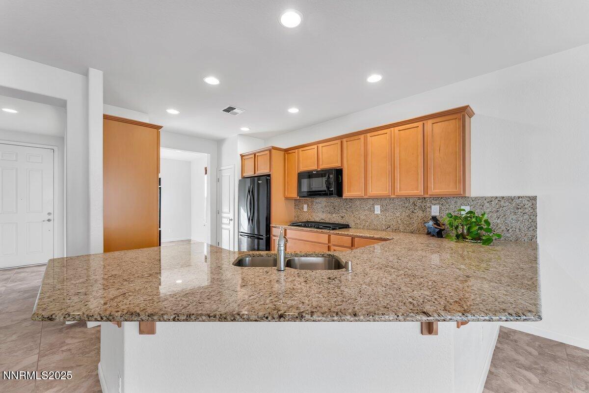 861 Larrimore Trail Reno, NV 89523 - Photo 5 of 24 a lobby with a couch and potted plant with potted plants