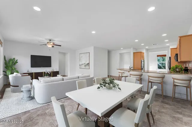 a view of a dining room with furniture and a livingroom