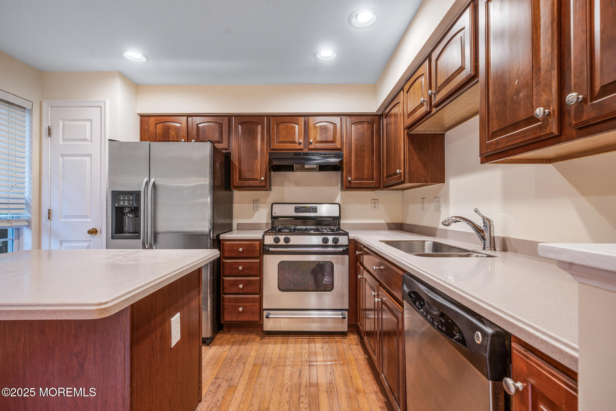 67 Saxton Road Farmingdale, NJ 07727 - Photo 11 of 41 a kitchen with stainless steel appliances granite countertop a sink stove and refrigerator