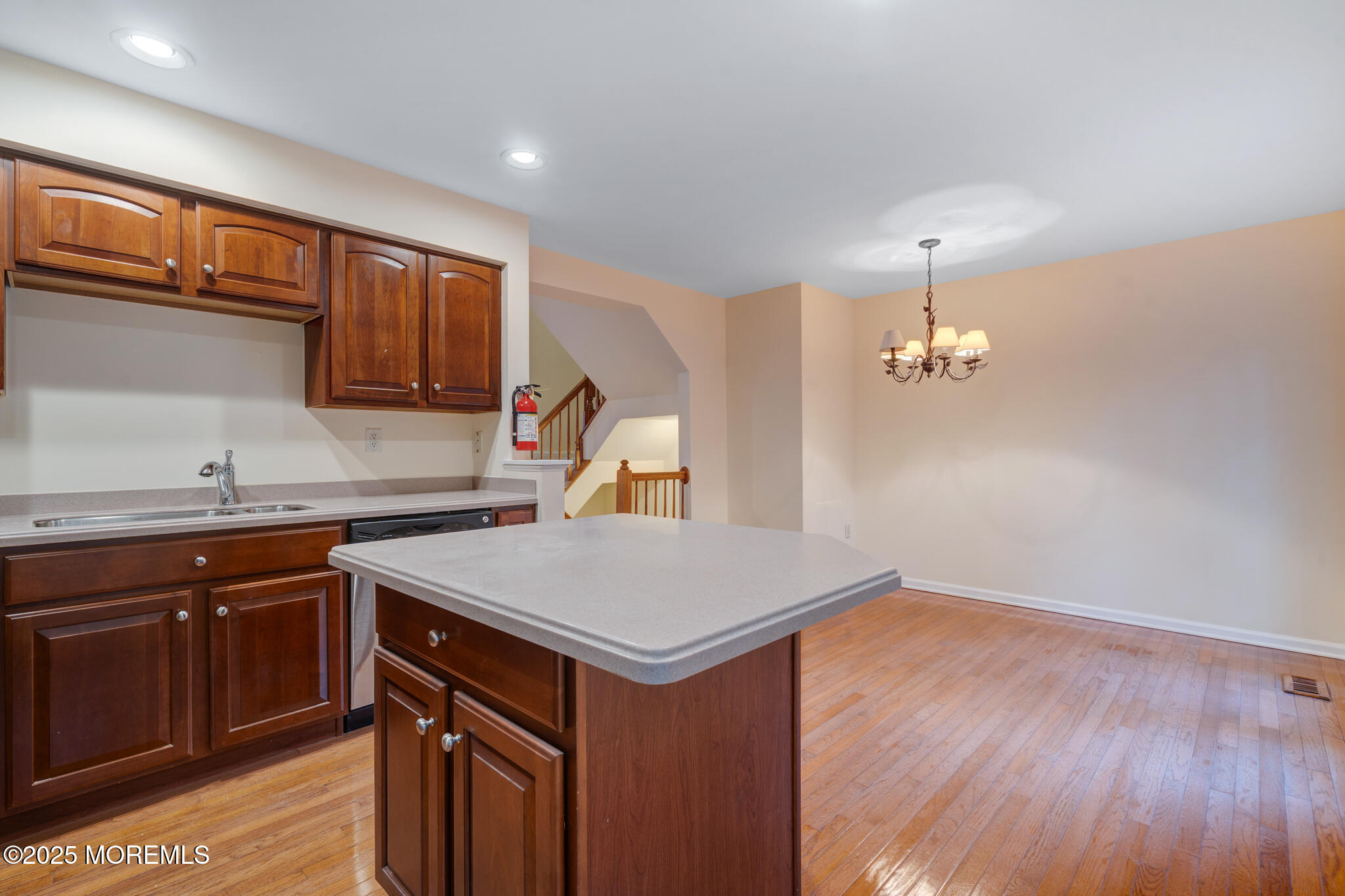 67 Saxton Road Farmingdale, NJ 07727 - Photo 12 of 41 a kitchen with a sink cabinets and wooden floor