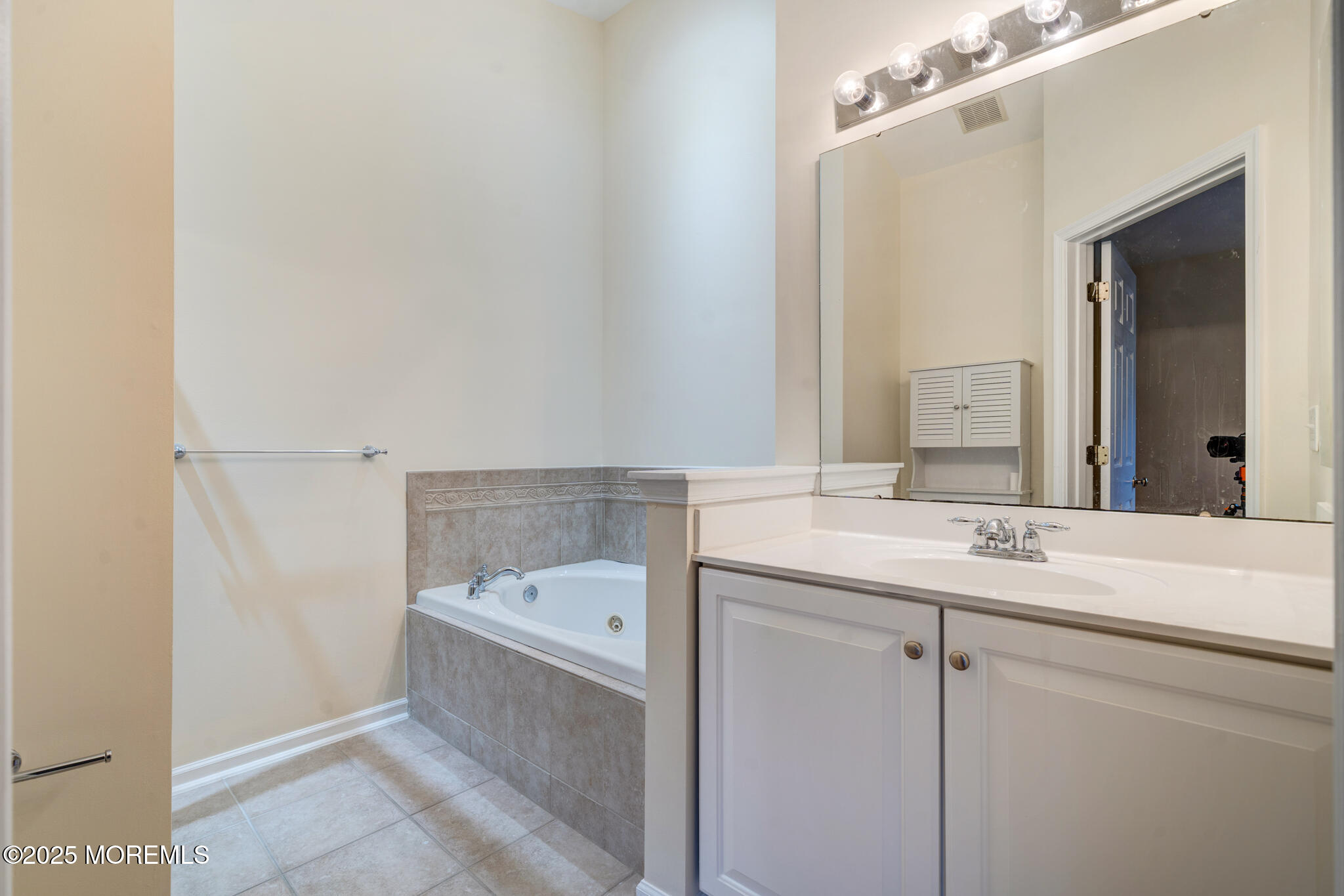 67 Saxton Road Farmingdale, NJ 07727 - Photo 21 of 41 a bathroom with a sink and a mirror