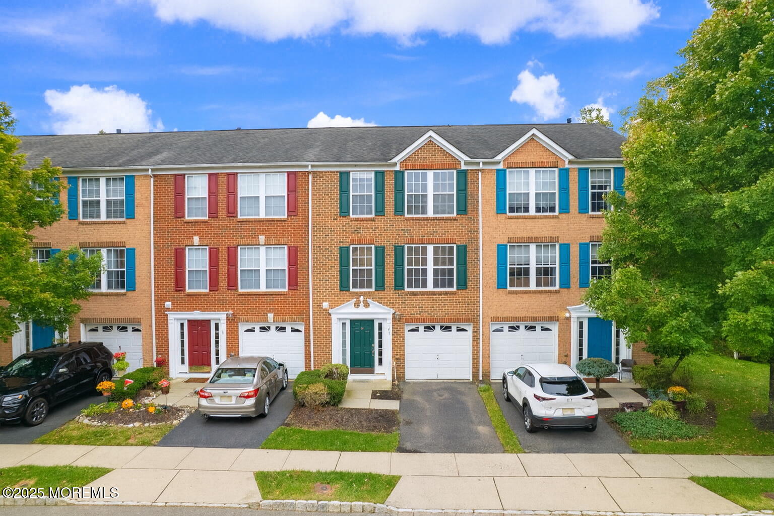67 Saxton Road Farmingdale, NJ 07727 - Photo 35 of 41 a front view of a residential apartment building with a yard