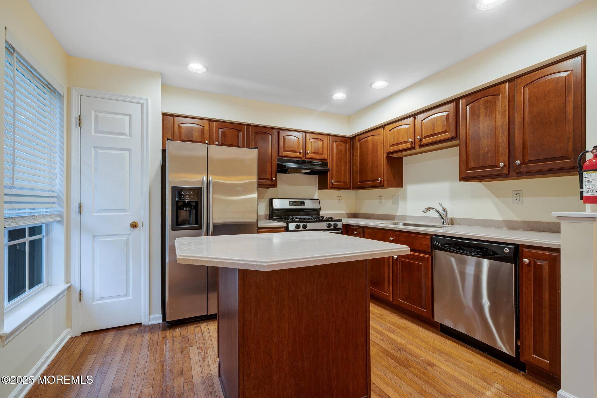 67 Saxton Road Farmingdale, NJ 07727 - Photo 10 of 41 a kitchen with stainless steel appliances granite countertop a sink stove and refrigerator