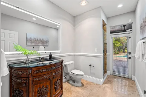 a bedroom with a flat screen television and a bed