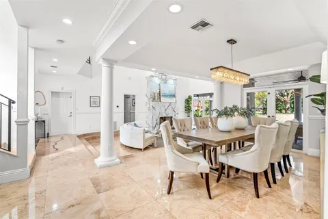 a kitchen with stainless steel appliances kitchen island granite countertop a sink and cabinets