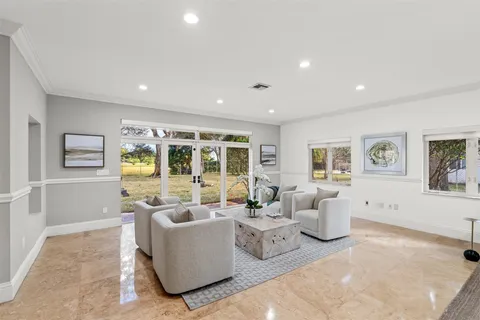 a kitchen with kitchen island a stove a table and chairs in it