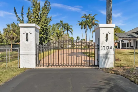 a view of a swimming pool with a yard