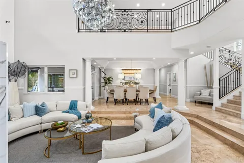 a bedroom with a large bed and a couch