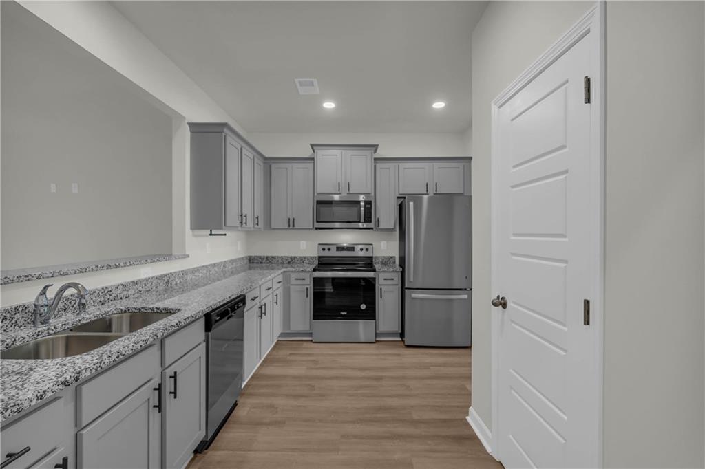 4289 Arcadia Drive Decatur, GA 30034 - Photo 11 of 11 a kitchen with a refrigerator stove and sink