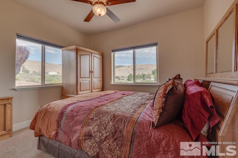 2730 Ramona Road Reno, NV 89521 - Photo 24 of 31 a bed sitting in a bedroom next to a window