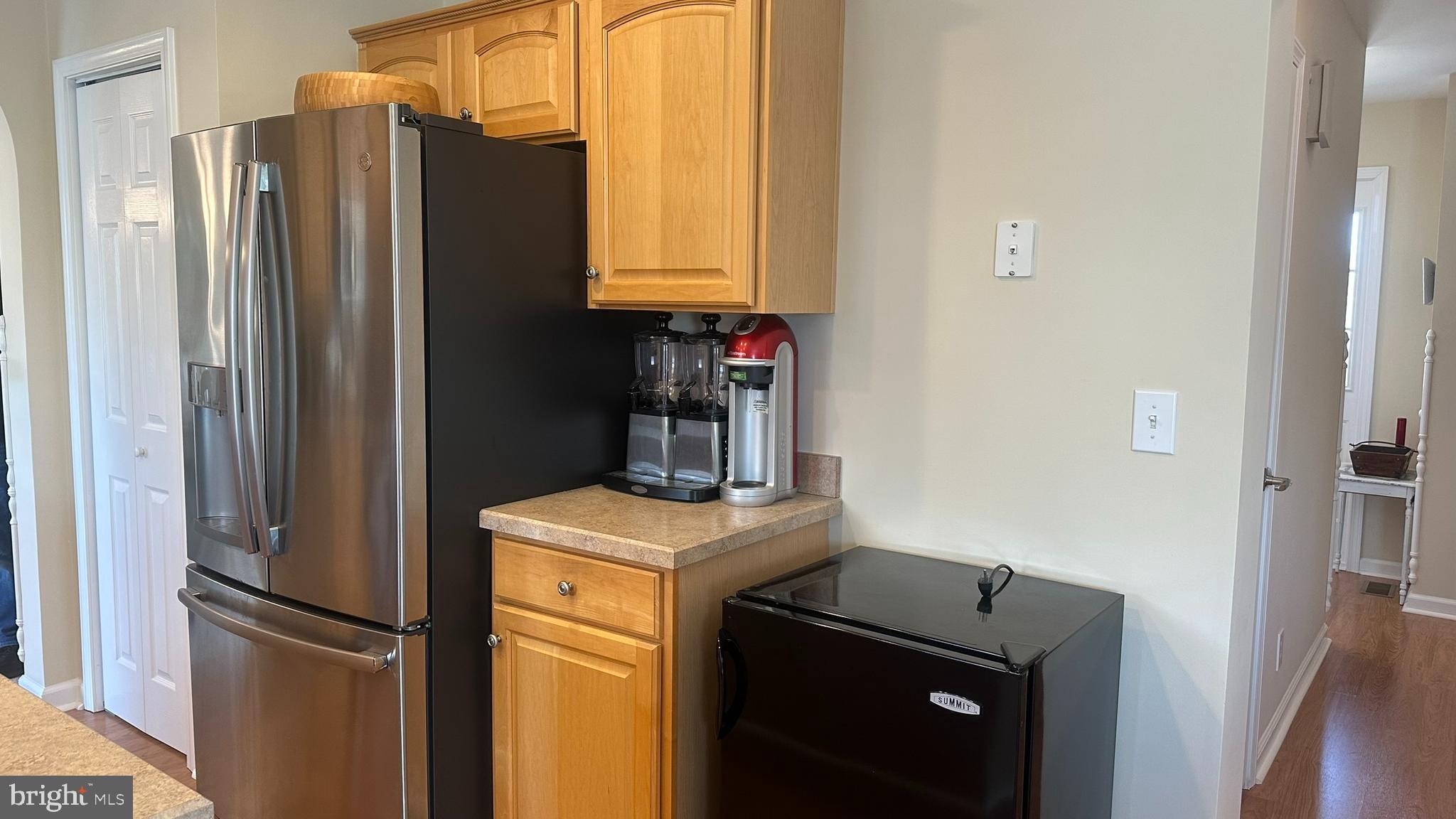 59 Weaver Drive Manahawkin, NJ 08050 - Photo 11 of 27 a kitchen with a refrigerator and cabinets