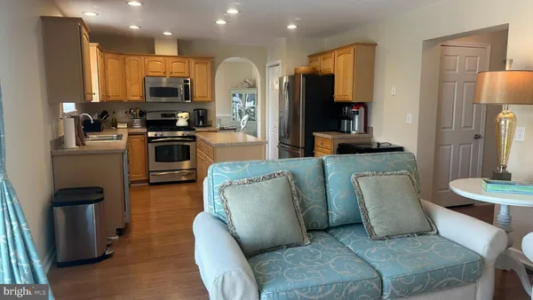 a dining room with furniture and a flat screen tv