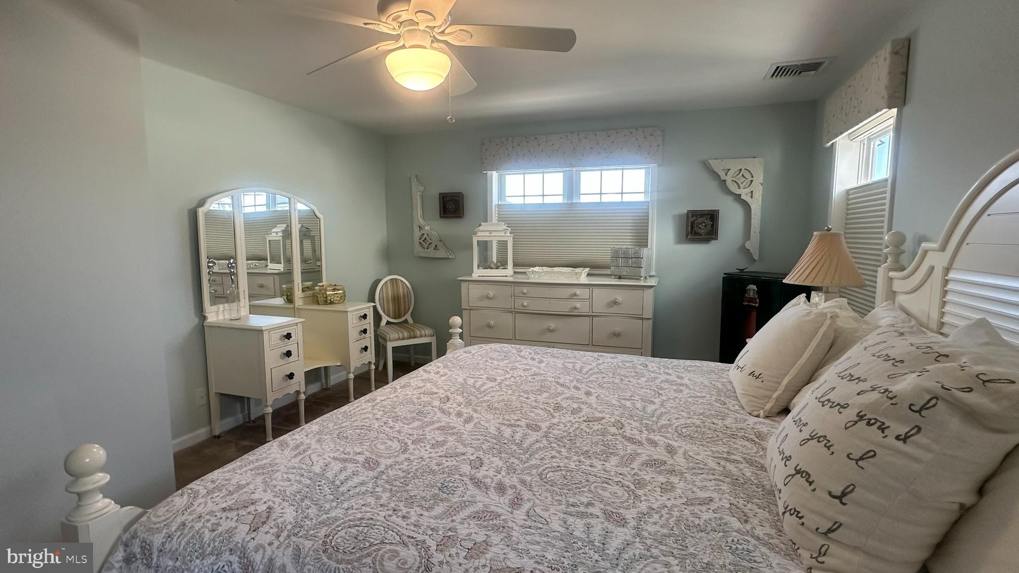 59 Weaver Drive Manahawkin, NJ 08050 - Photo 17 of 27 a bedroom with a bed and a chandelier
