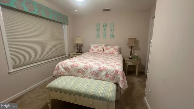 a bedroom with a bed and a chair