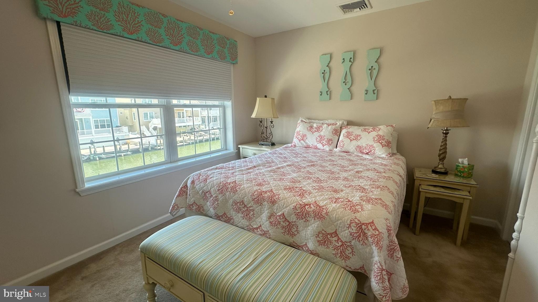 59 Weaver Drive Manahawkin, NJ 08050 - Photo 25 of 27 a bedroom with a bed and a chair