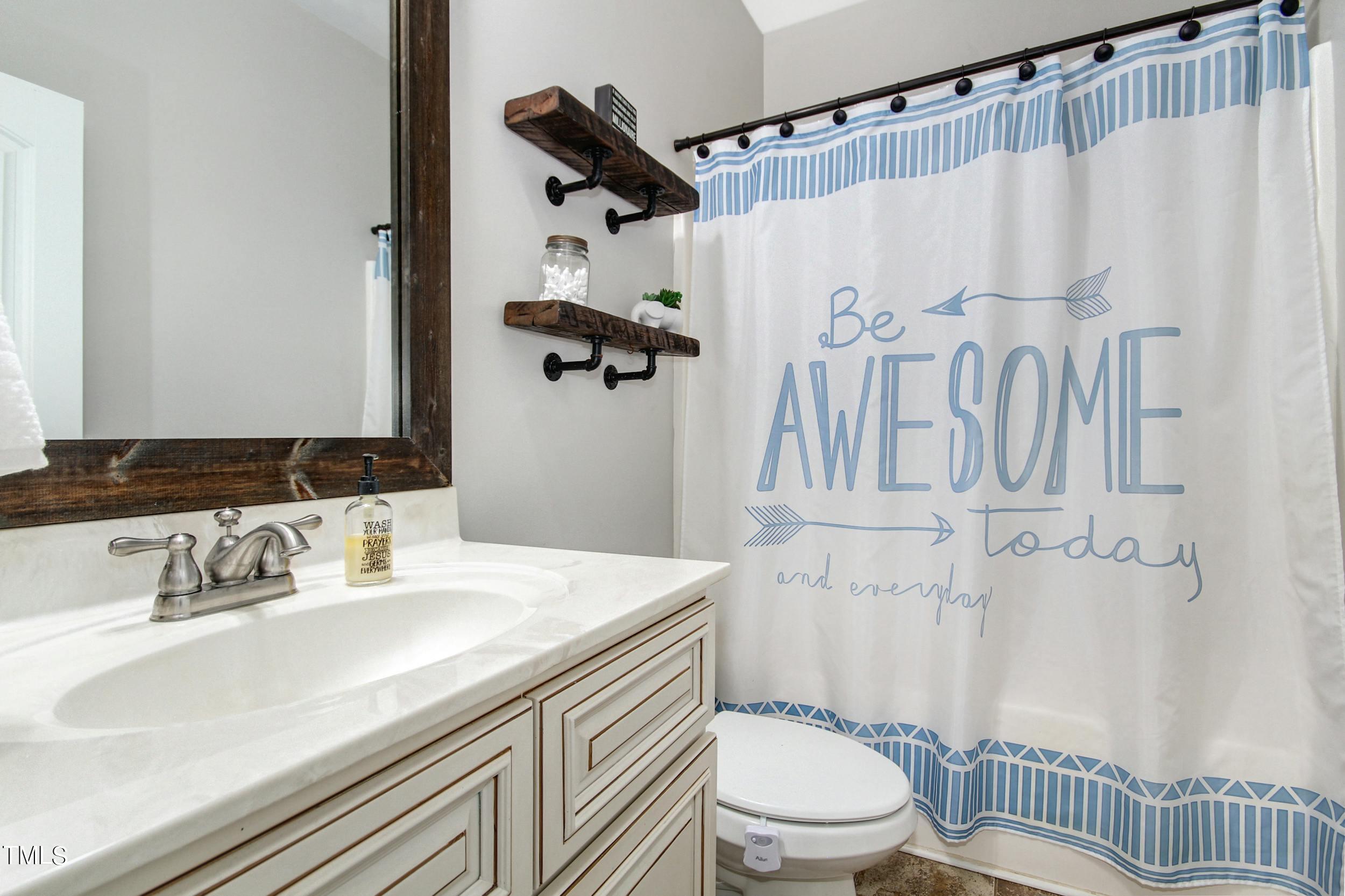 10354 Pasture Road Middlesex, NC 27557 - Photo 17 of 26 a bathroom with a sink toilet and shower