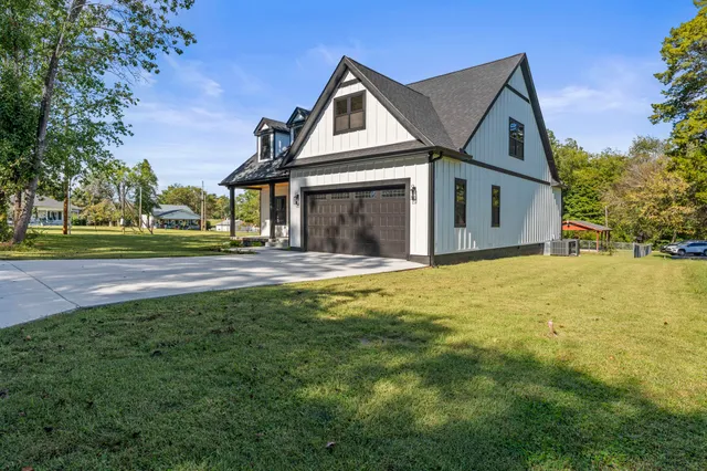 a front view of a house with a yard