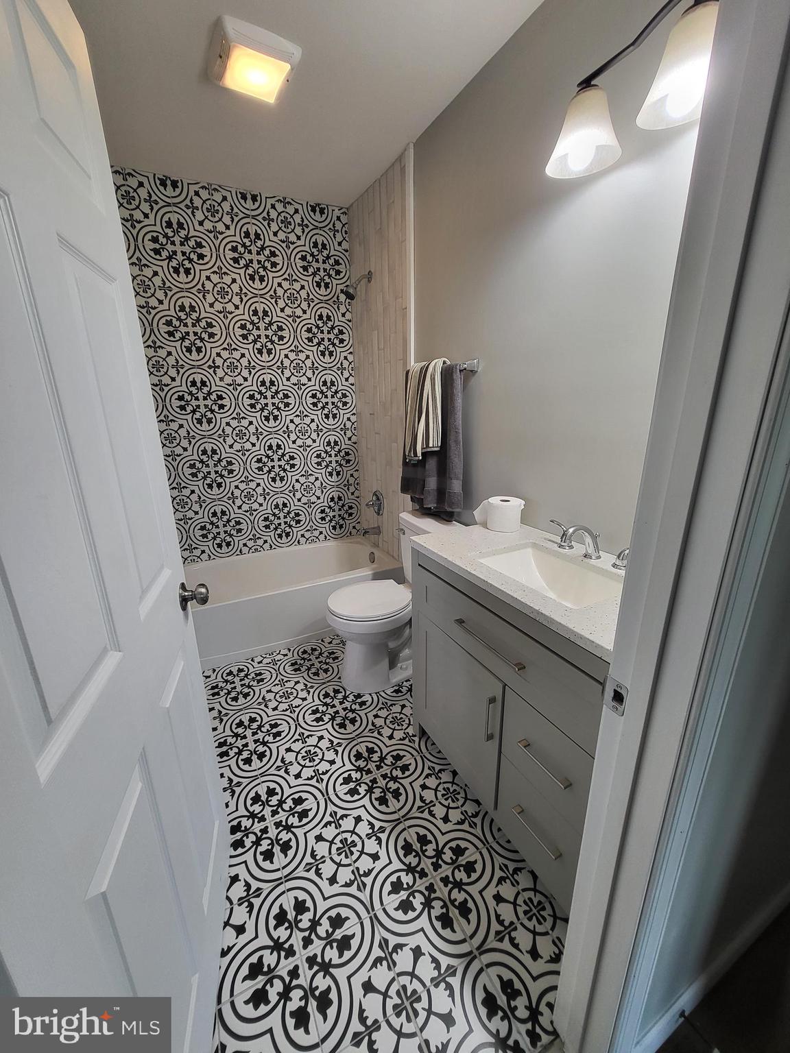 955 Kitts Hummock Road Dover, DE 19901 - Photo 10 of 16 a bathroom with a sink toilet and shower