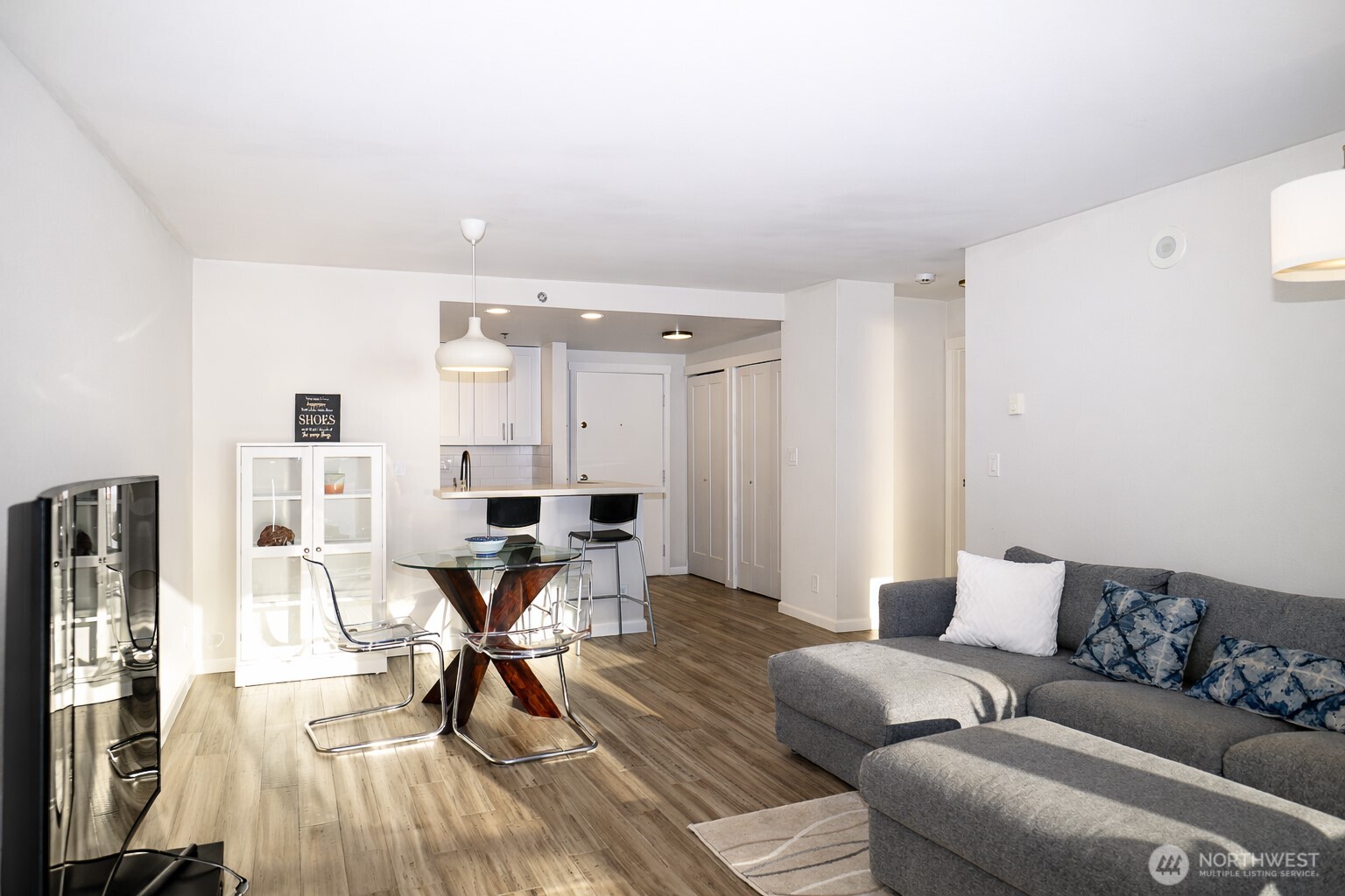 121 Vine Street, Unit 1702 Seattle, WA 98121 - Photo 13 of 37 a living room with furniture and kitchen view