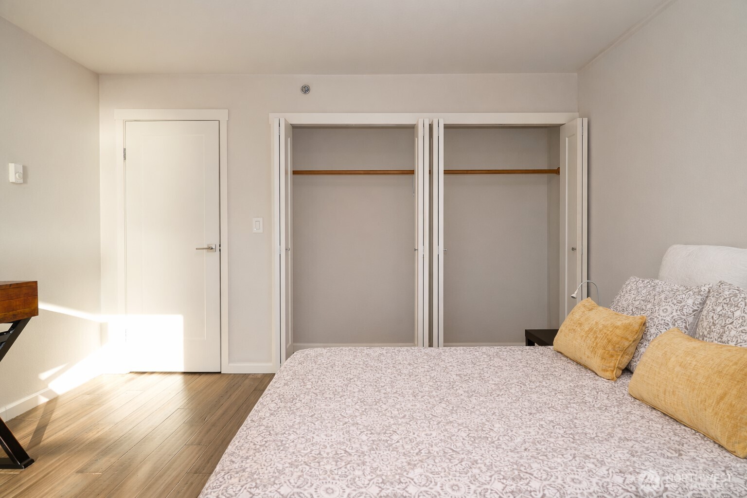 121 Vine Street, Unit 1702 Seattle, WA 98121 - Photo 17 of 37 a bedroom with a bed and a rug