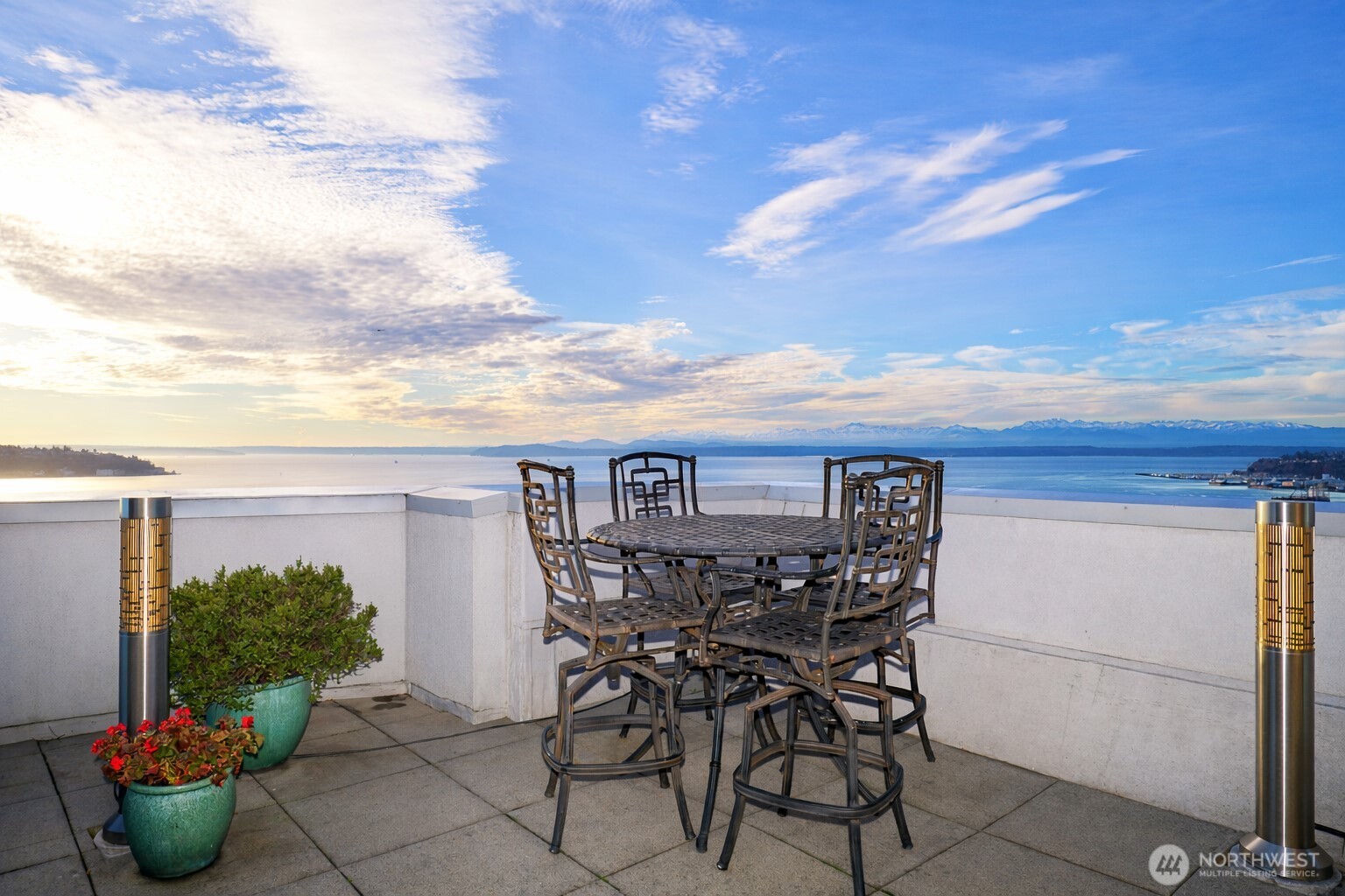 121 Vine Street, Unit 1702 Seattle, WA 98121 - Photo 29 of 37 a view of a chairs and table in the terrace