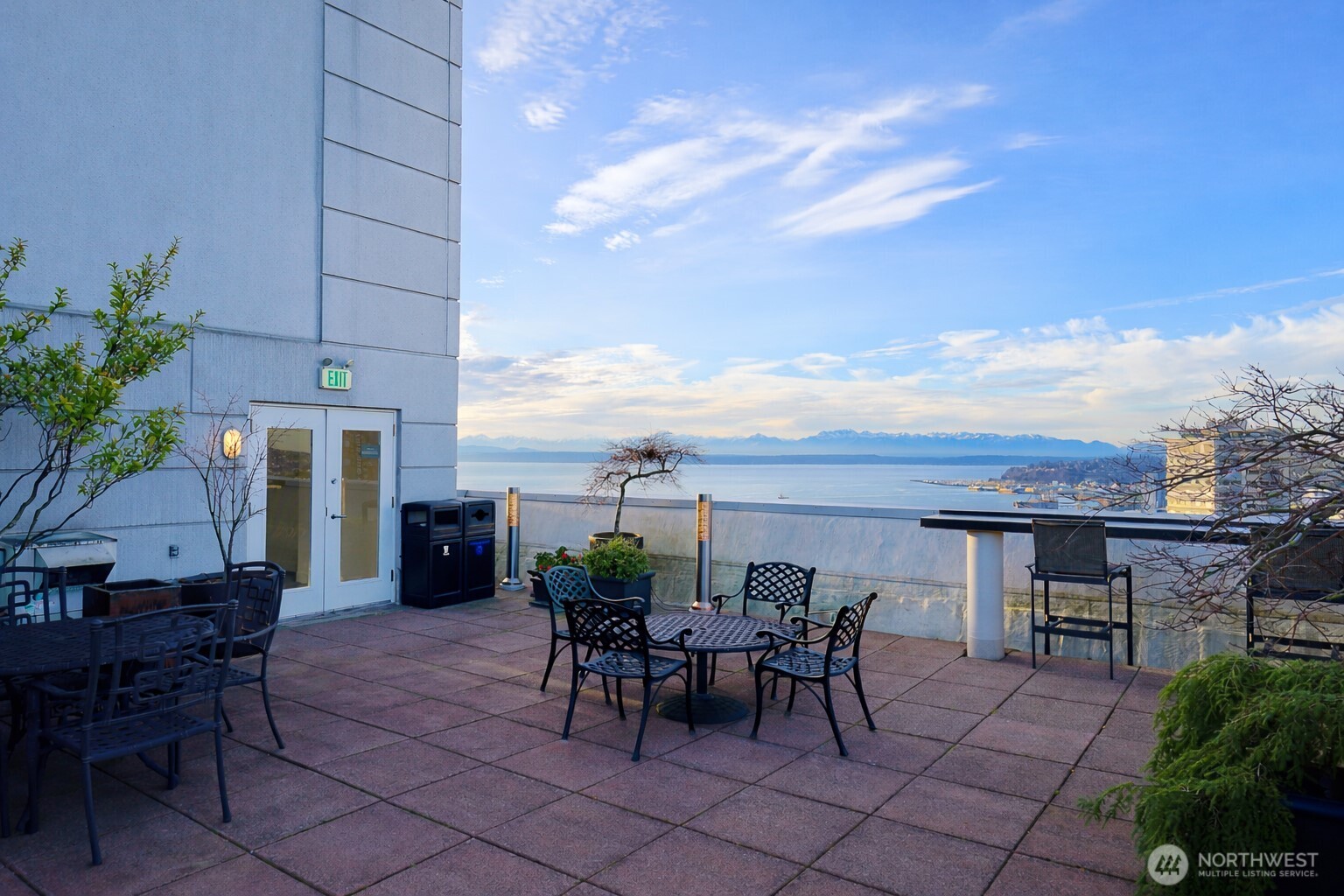 121 Vine Street, Unit 1702 Seattle, WA 98121 - Photo 32 of 37 a view of a patio with a table and chairs