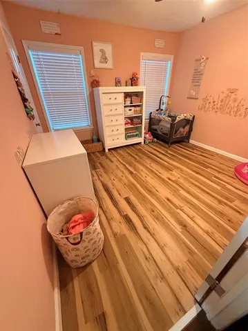 a view of a balcony with a table and chairs