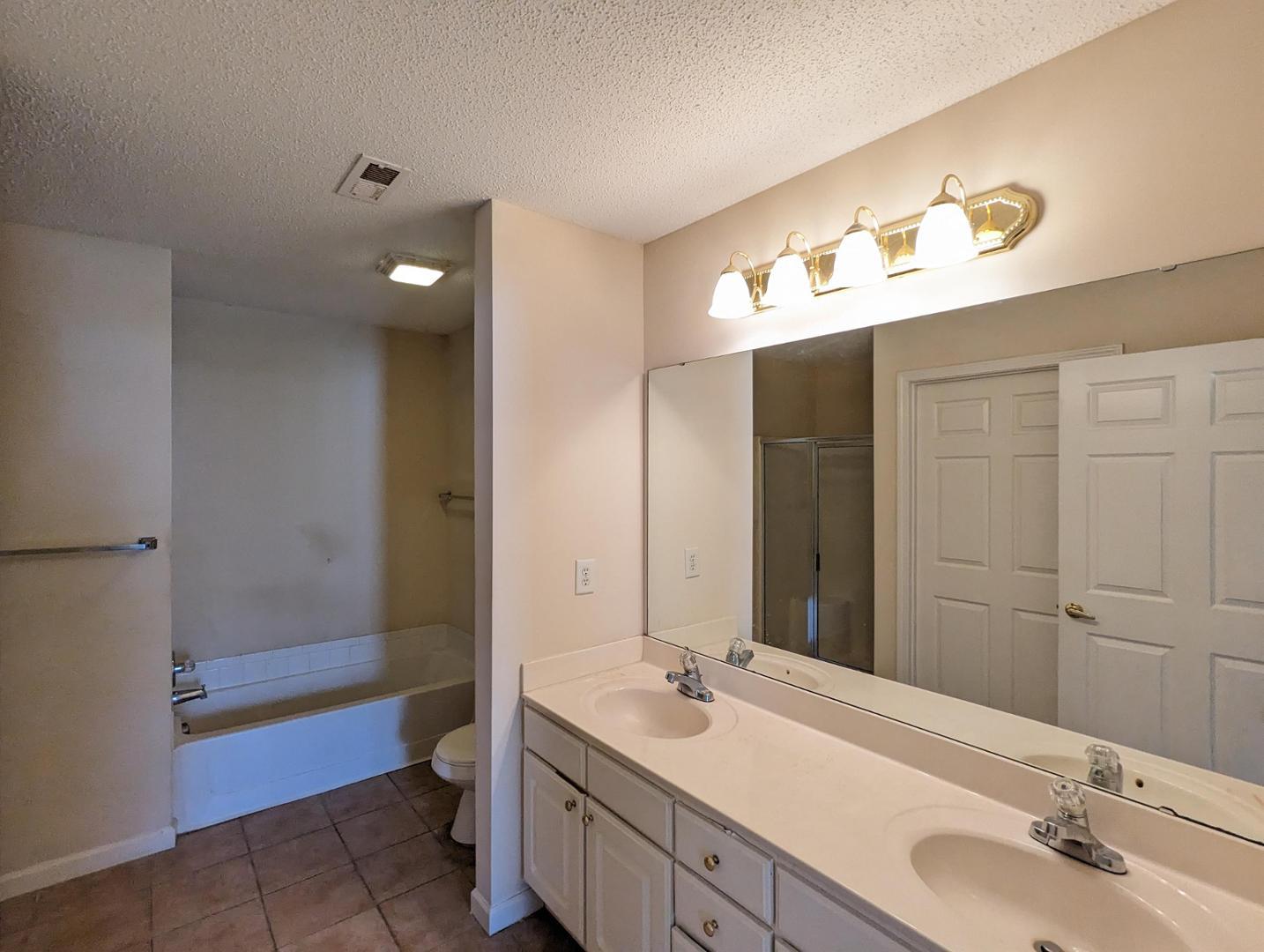 11370 Clubhaven Place Raleigh, NC 27617 - Photo 14 of 19 a bathroom with a sink and a mirror