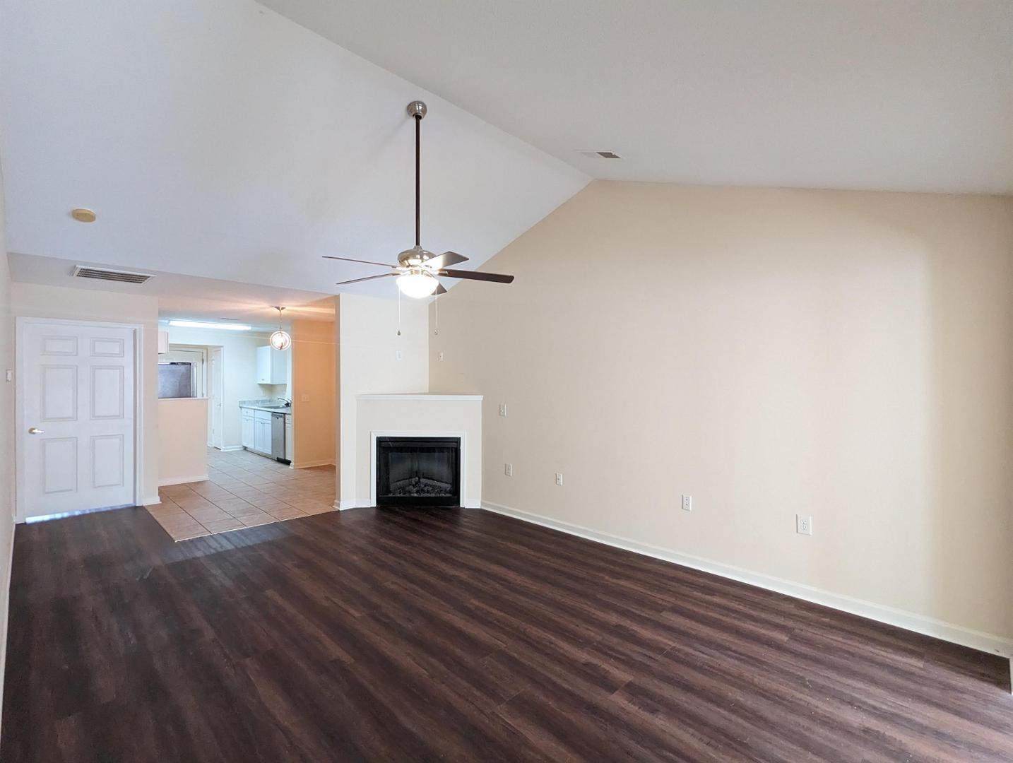 11370 Clubhaven Place Raleigh, NC 27617 - Photo 4 of 19 a view of empty room with wooden floor fireplace and window