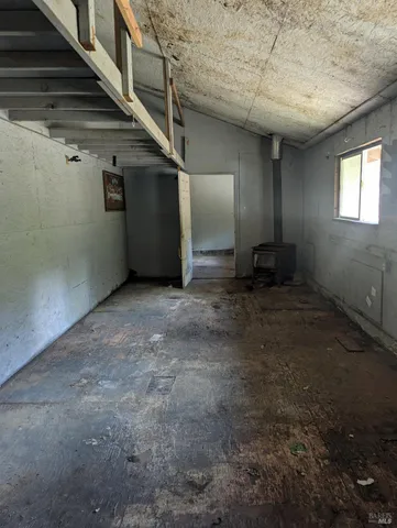 a view of a hallway with wooden shelves