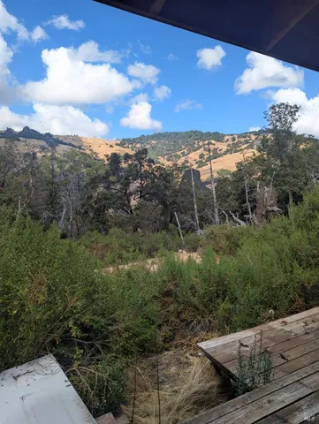 a view of a yard with mountain view and mountain view