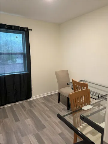 a bed room with furniture and window