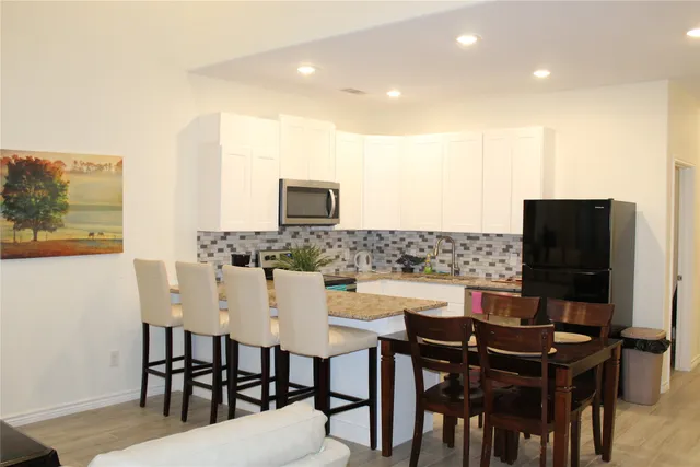 a view of a dining room with furniture