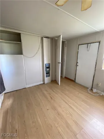 a view of an empty room with a fireplace