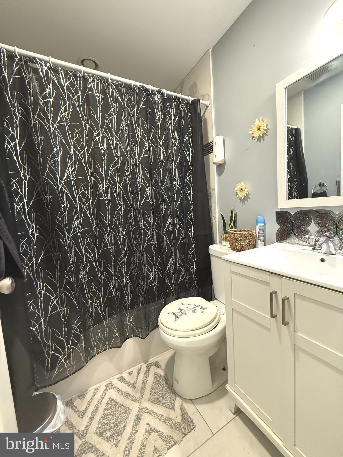 653 North 37th Street Philadelphia, PA 19104 - Photo 12 of 20 a bathroom with a toilet sink and mirror