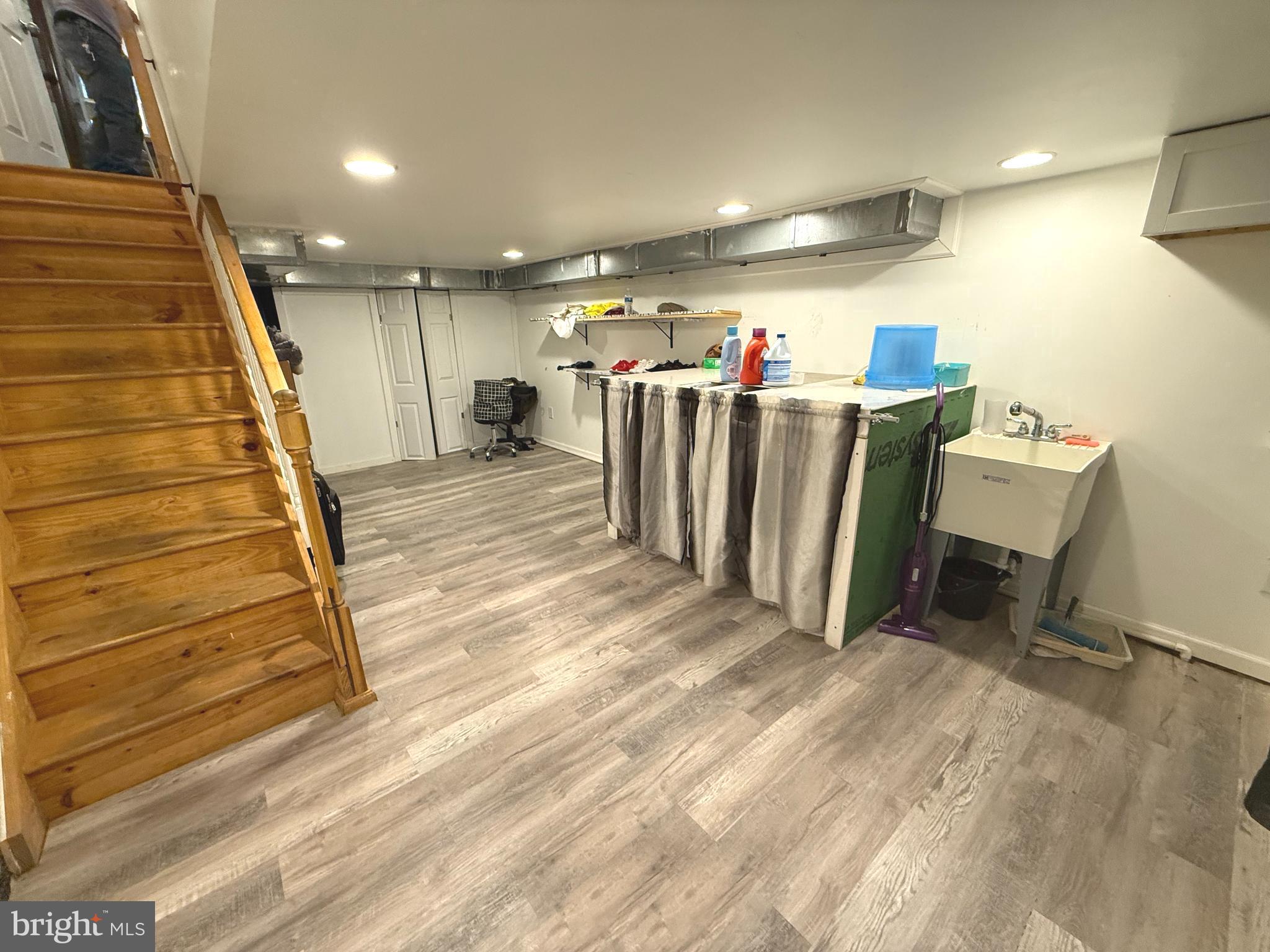 653 North 37th Street Philadelphia, PA 19104 - Photo 15 of 20 a view of a room with stairs and a projector