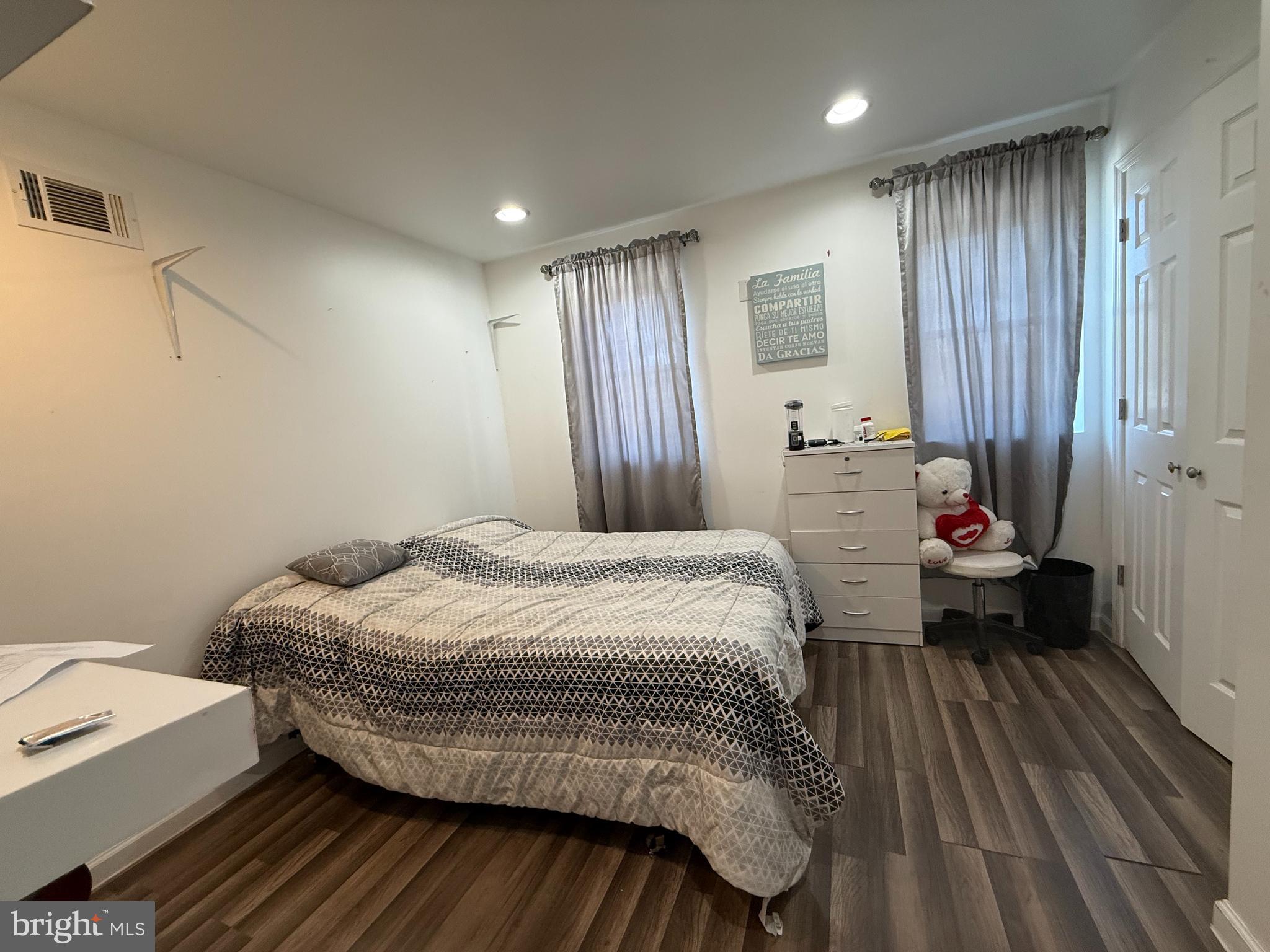 653 North 37th Street Philadelphia, PA 19104 - Photo 8 of 20 a bedroom with a bed and wooden floor