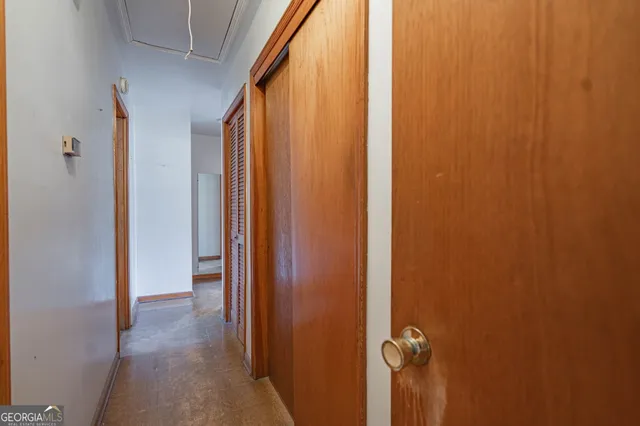 a view of a bathroom from the hallway