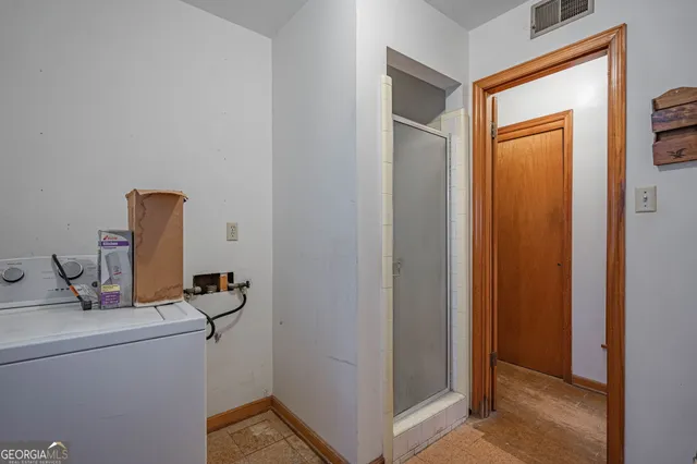 a bathroom with a sink toilet vanity and window
