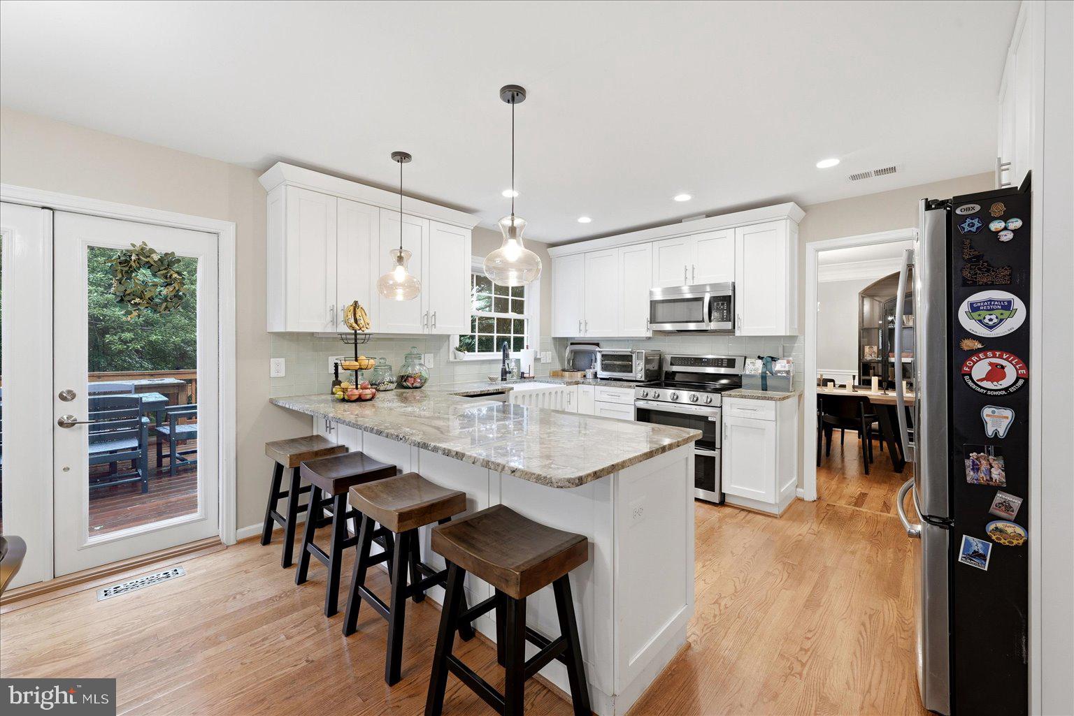 911 Riva Ridge Drive Great Falls, VA 22066 - Photo 14 of 55 Modern kitchen with inviting charm.