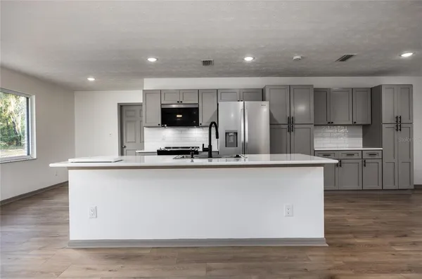 a kitchen with a sink and a window