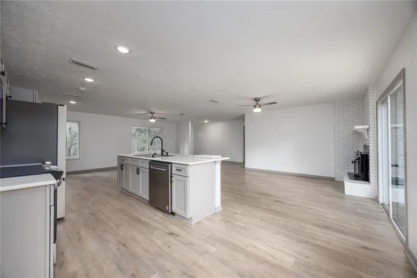 a view of a kitchen cabinets and wooden floor