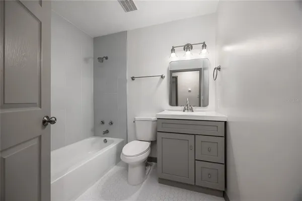 a room that has a sink and a stove in it