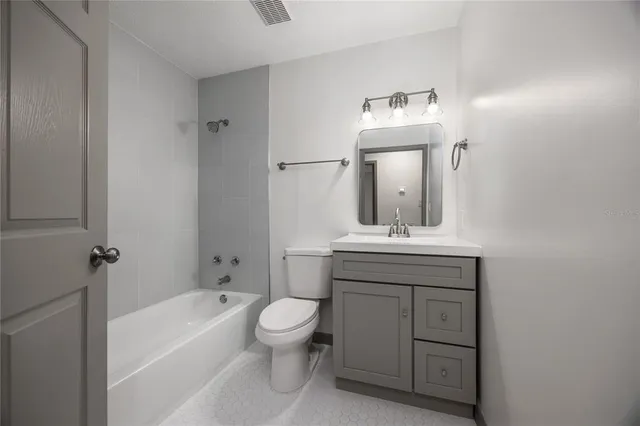 a room that has a sink and a stove in it