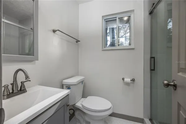 a view of a refrigerator and window