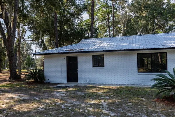 a view of a backyard of the house