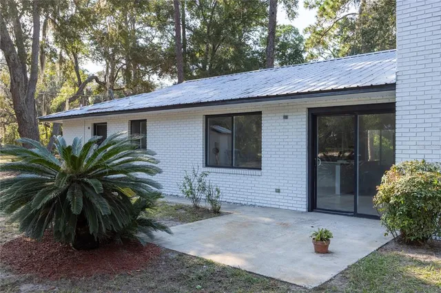 a house that has a tree in front of it